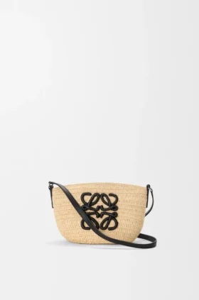 Eclipse-pochette i raffia och kalvskinn
