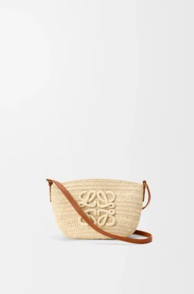 Eclipse-pochette i raffia och kalvskinn